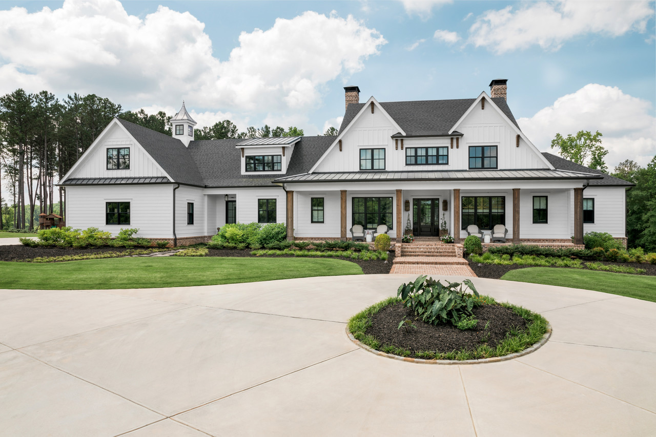 Intown Farm — white board-and-batten farmhouse exterior with wraparound porch