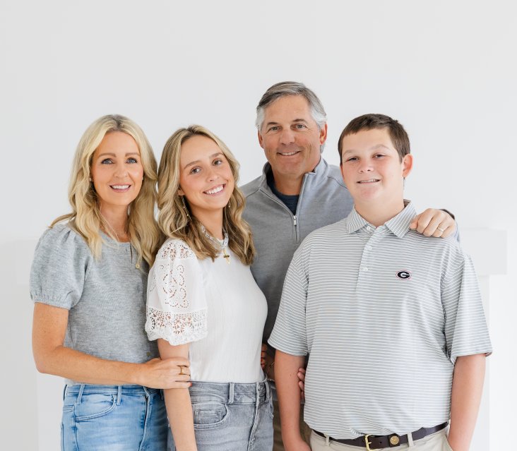The Davis family — Tyler Davis, founder of Athens Building Company, with his wife and children